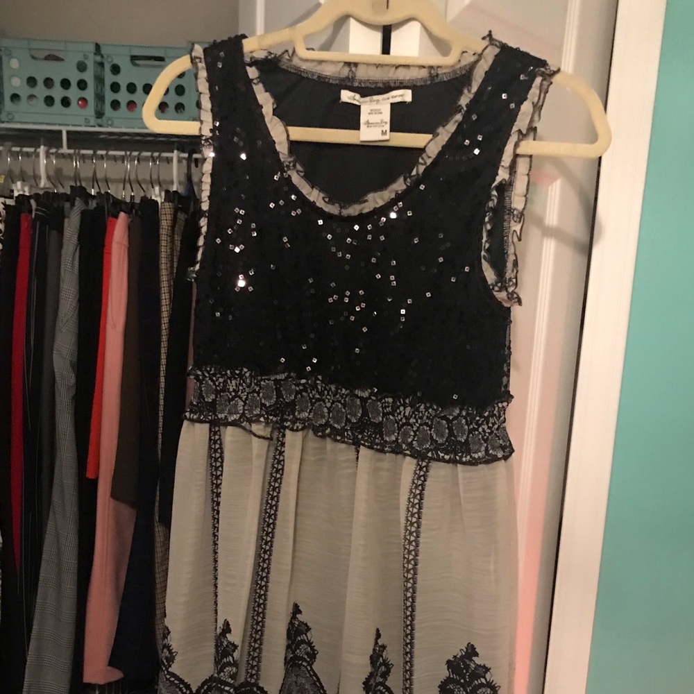Sleeveless sequin dress with cotton bottom.